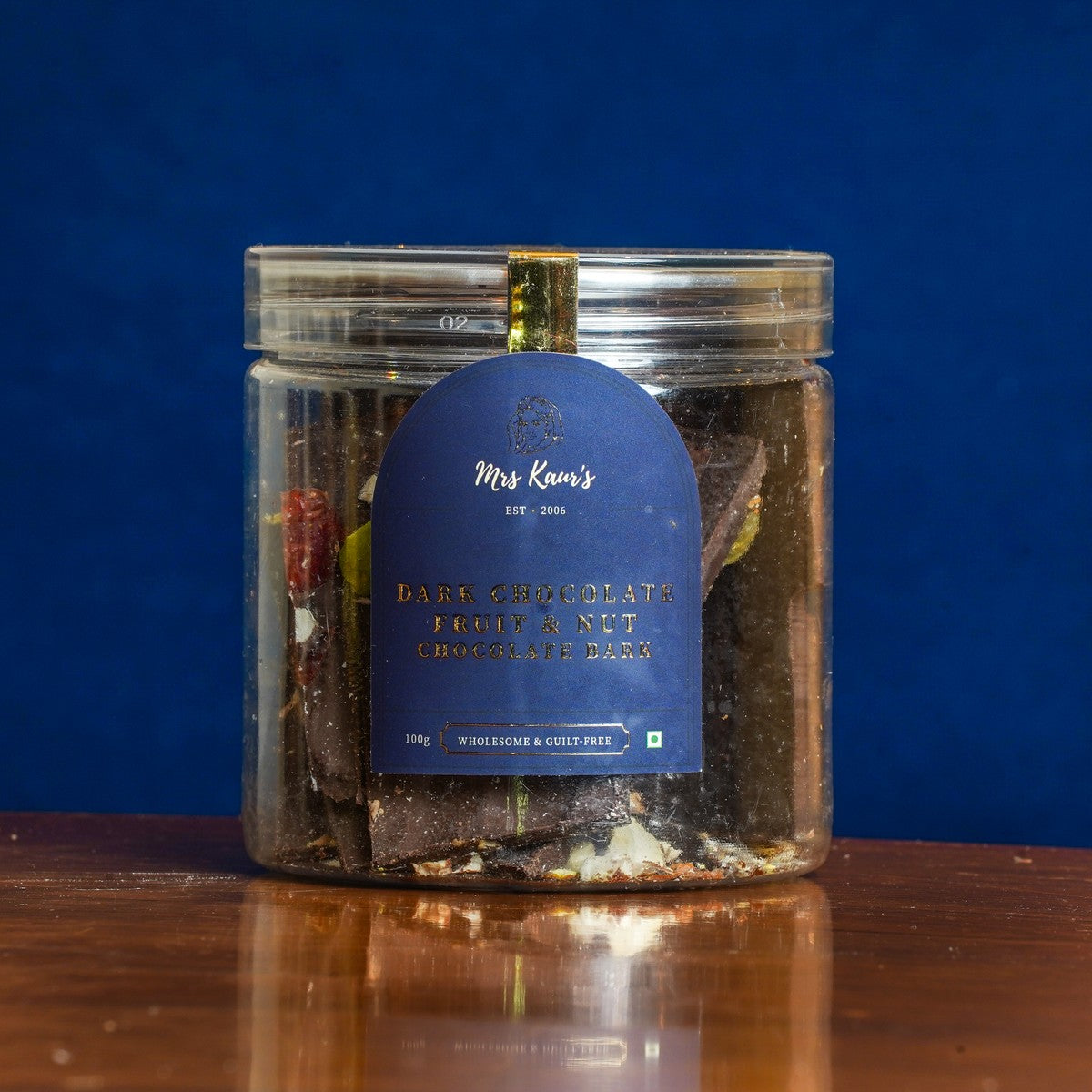 Dark Chocolate Fruit & Nut Bark: shards of dark chocolate with nuts and red dried fruit, in a clear jar