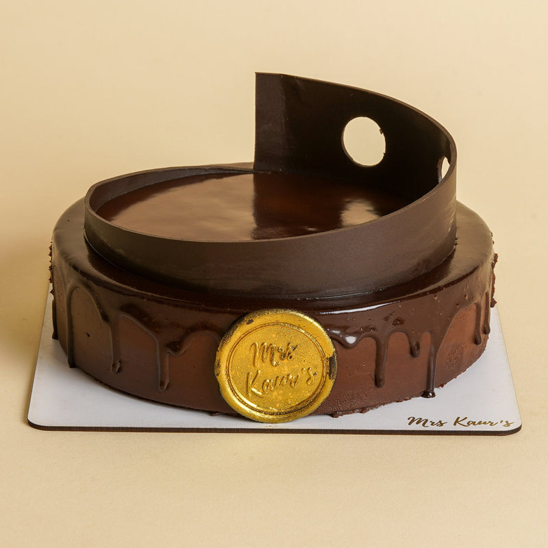 Raspberry Chocolate Mousse Cake on a Mrs Kaur’s cake board