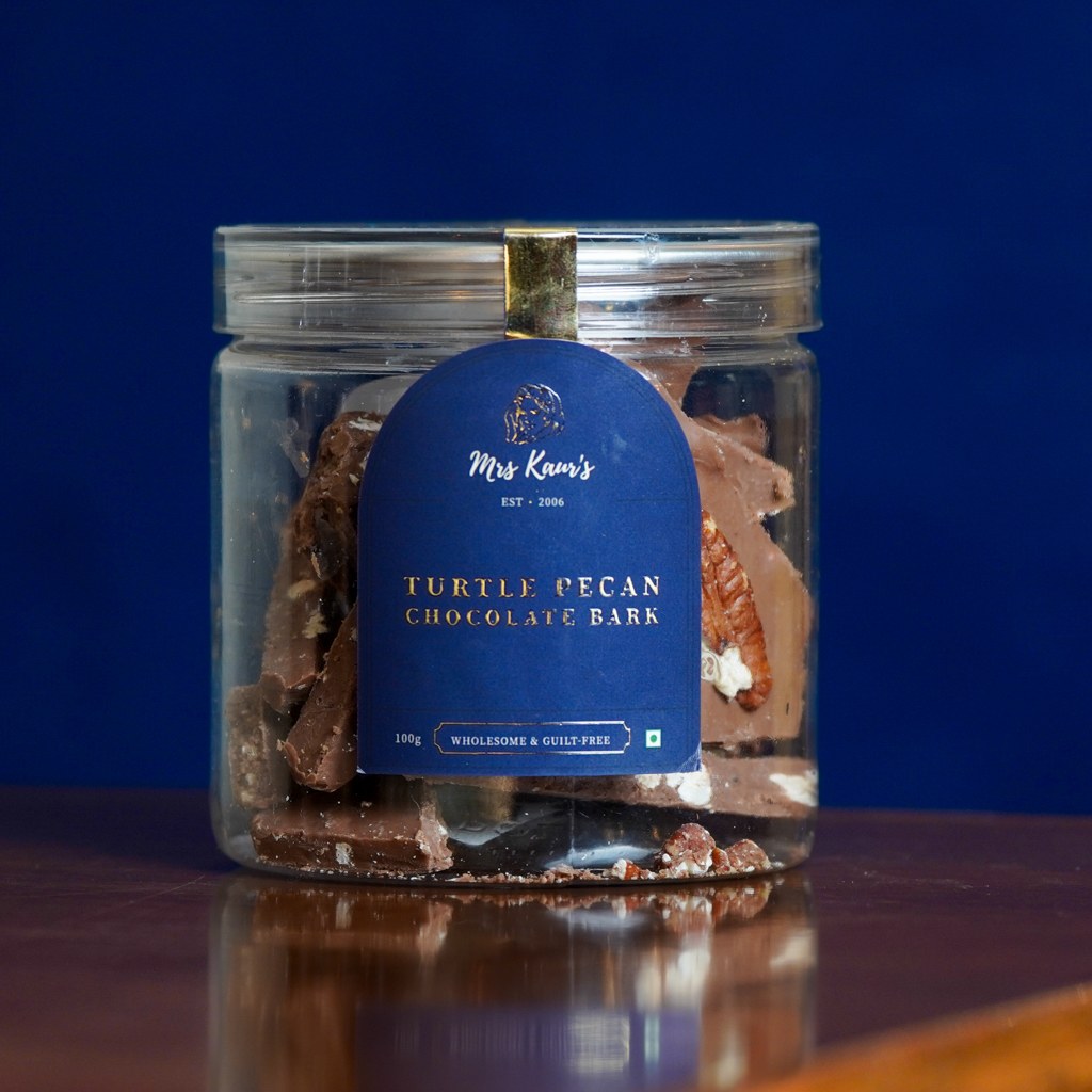 Turtle Pecan Chocolate Bark: pieces of milk chocolate bark with pecans, in a clear jar