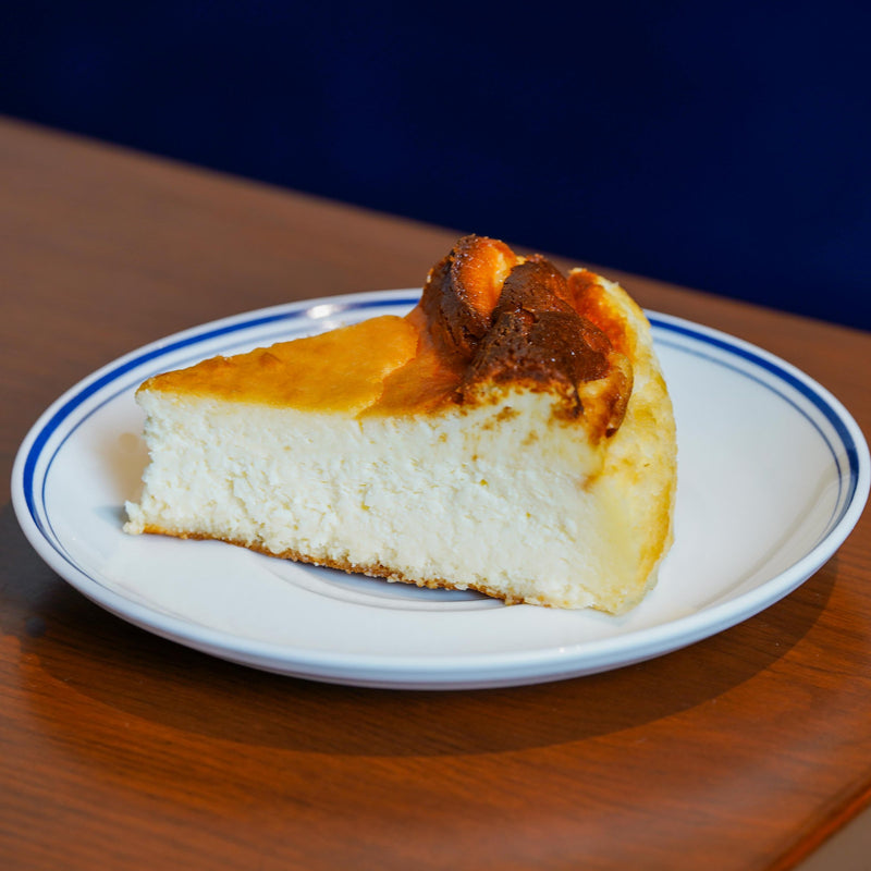 A slice of Burnt Basque Cheesecake on a Mrs Kaur’s plate